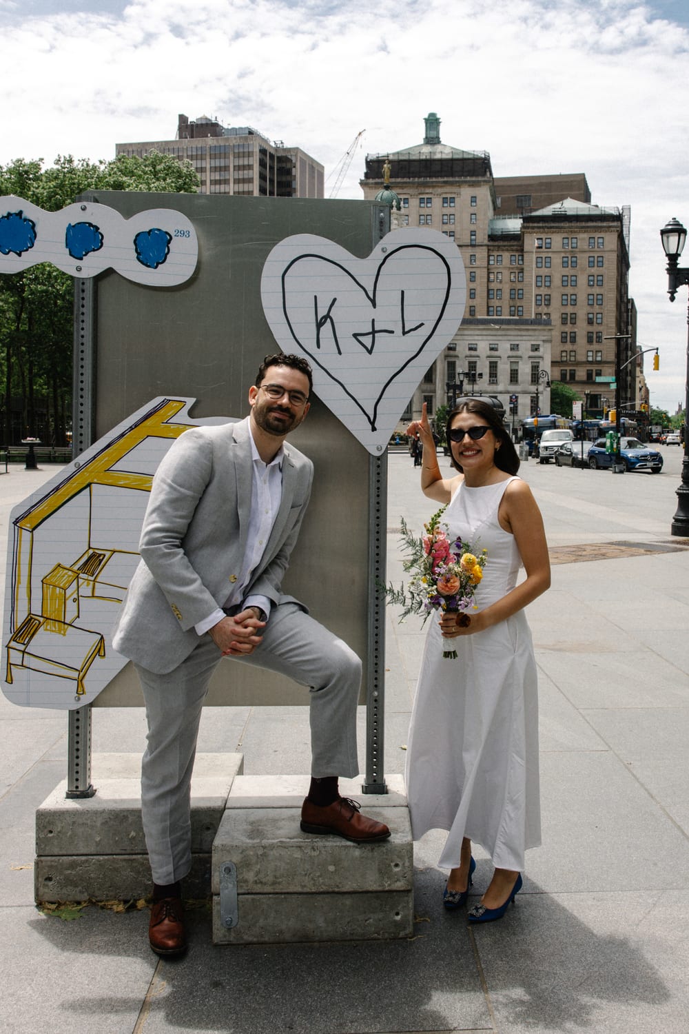 Katherine and Liam beside a heart with their initials