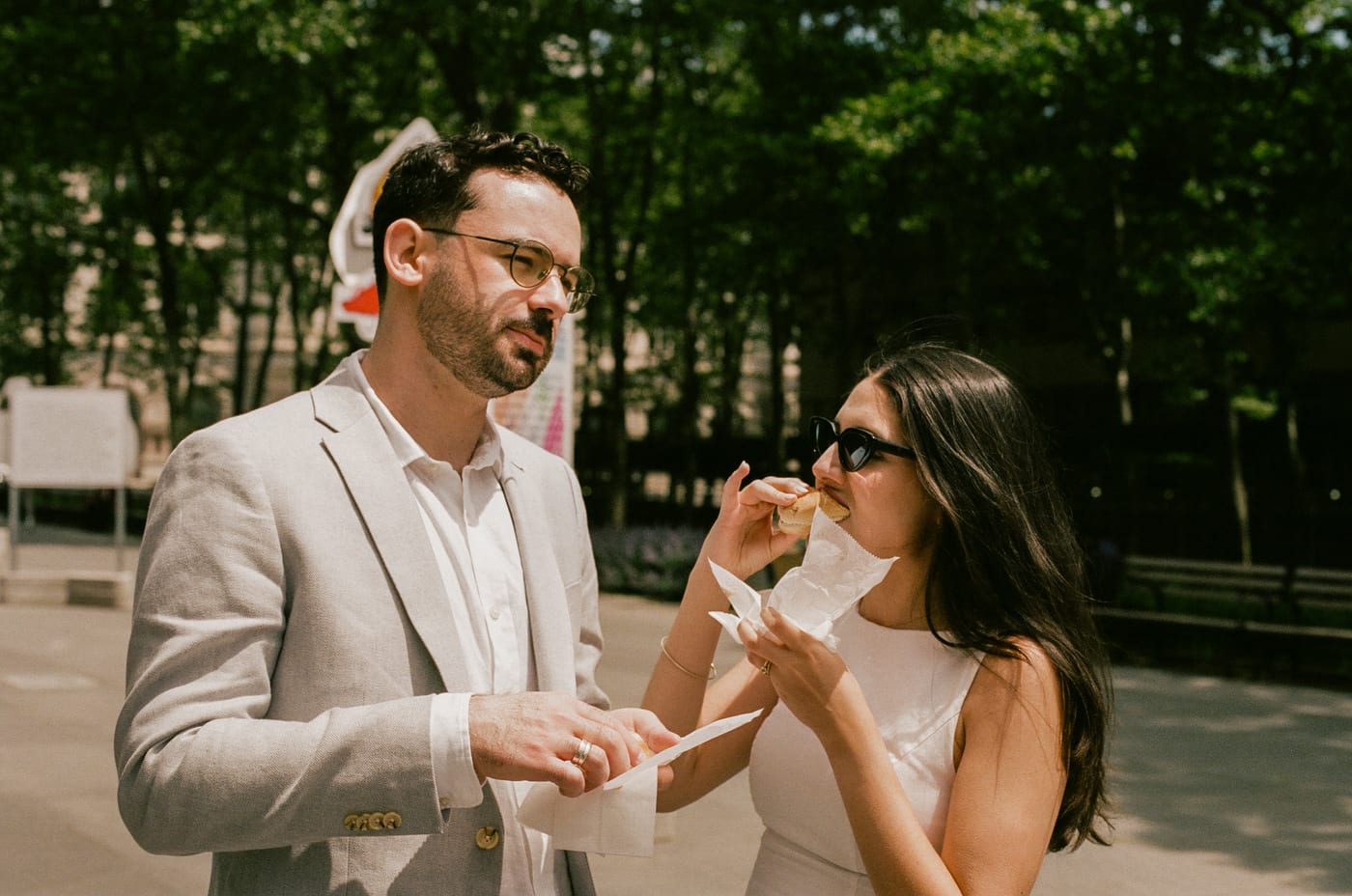 Katherine and Liam sharing a snack after their civil ceremony
